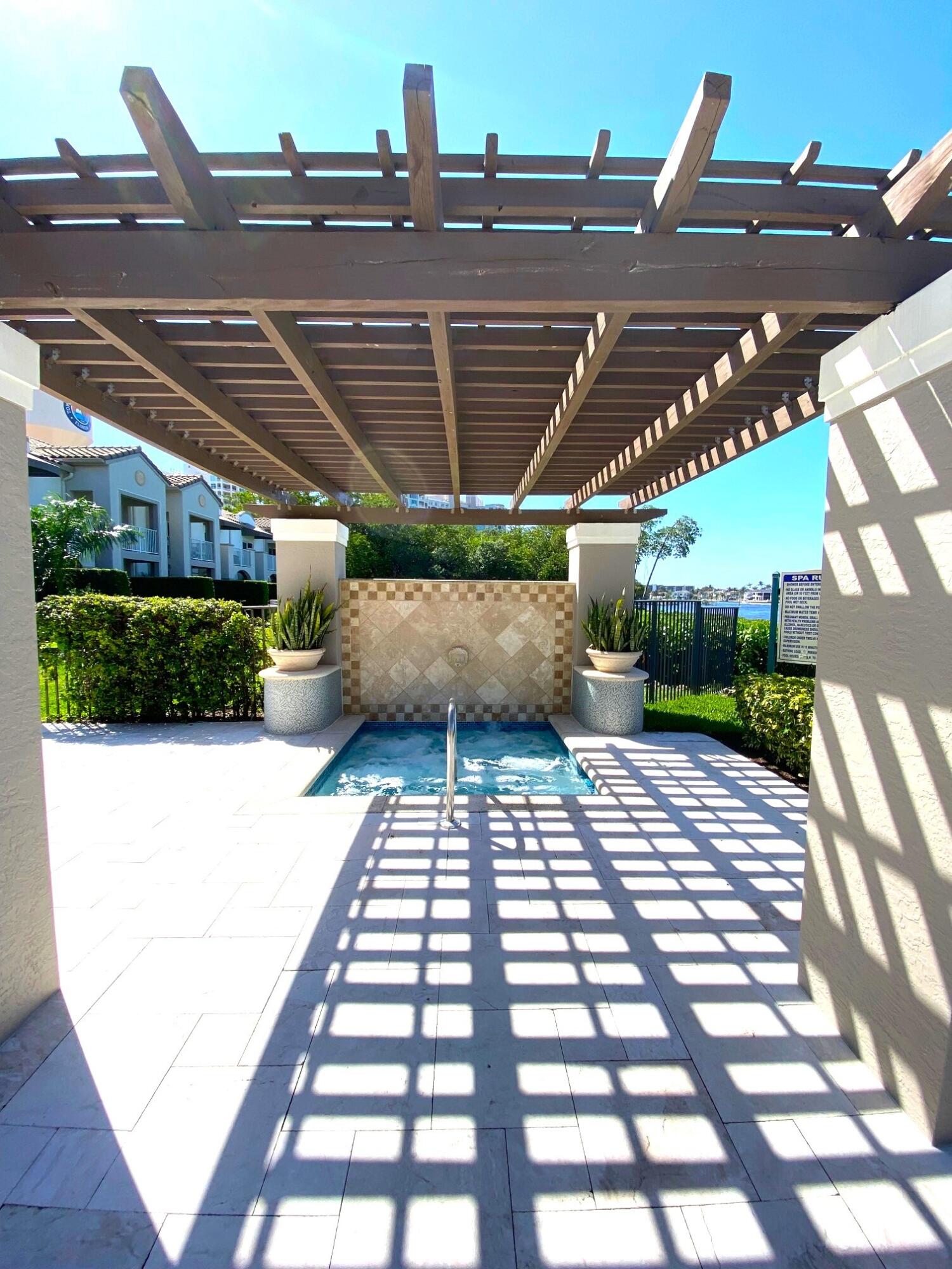 3594 South Ocean Boulevard, Unit 207 Highland Beach, FL 33487 - Photo 34 of 56 a view of a backyard with sitting area