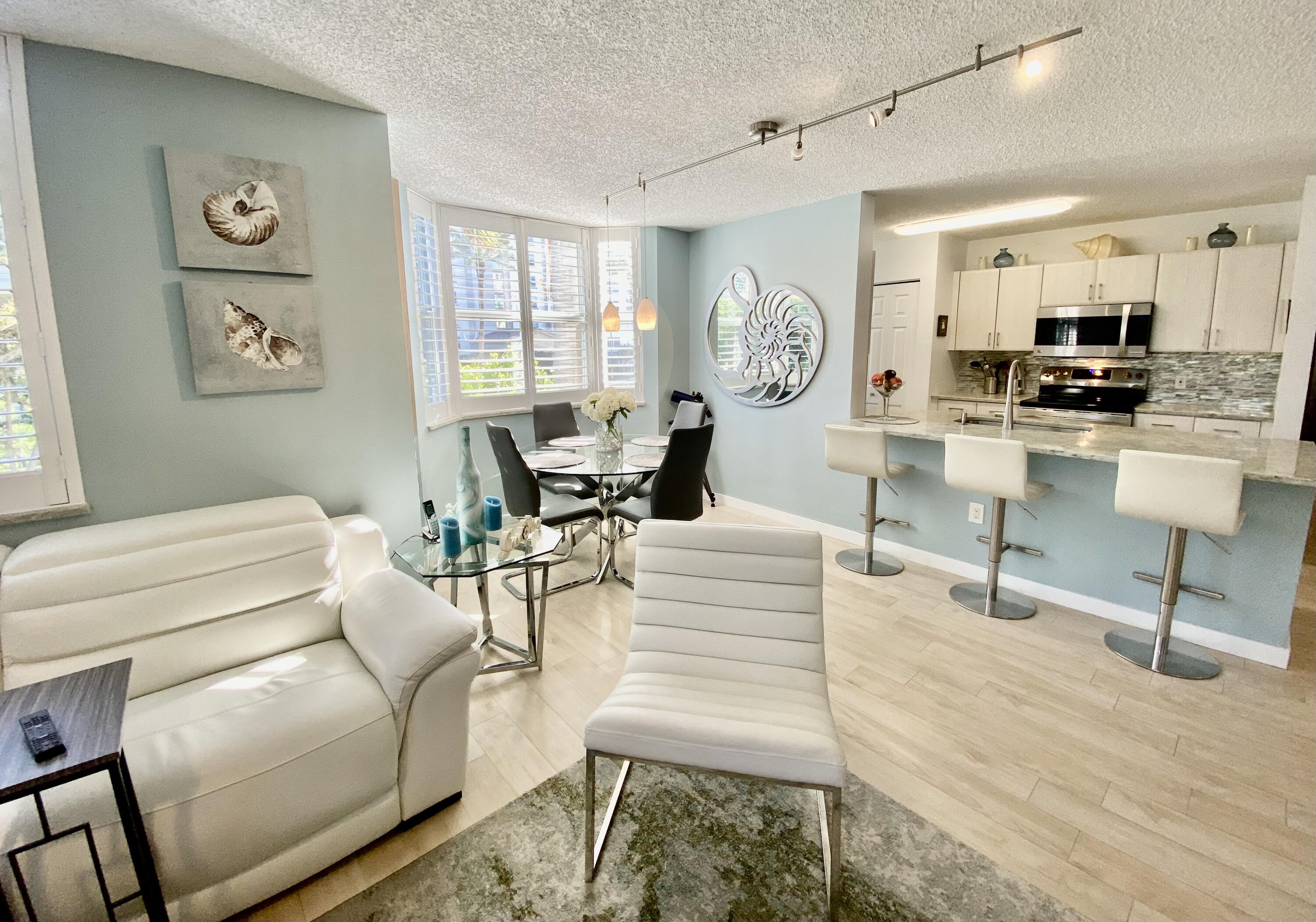 3594 South Ocean Boulevard, Unit 207 Highland Beach, FL 33487 - Photo 4 of 56 a living room with furniture and a window