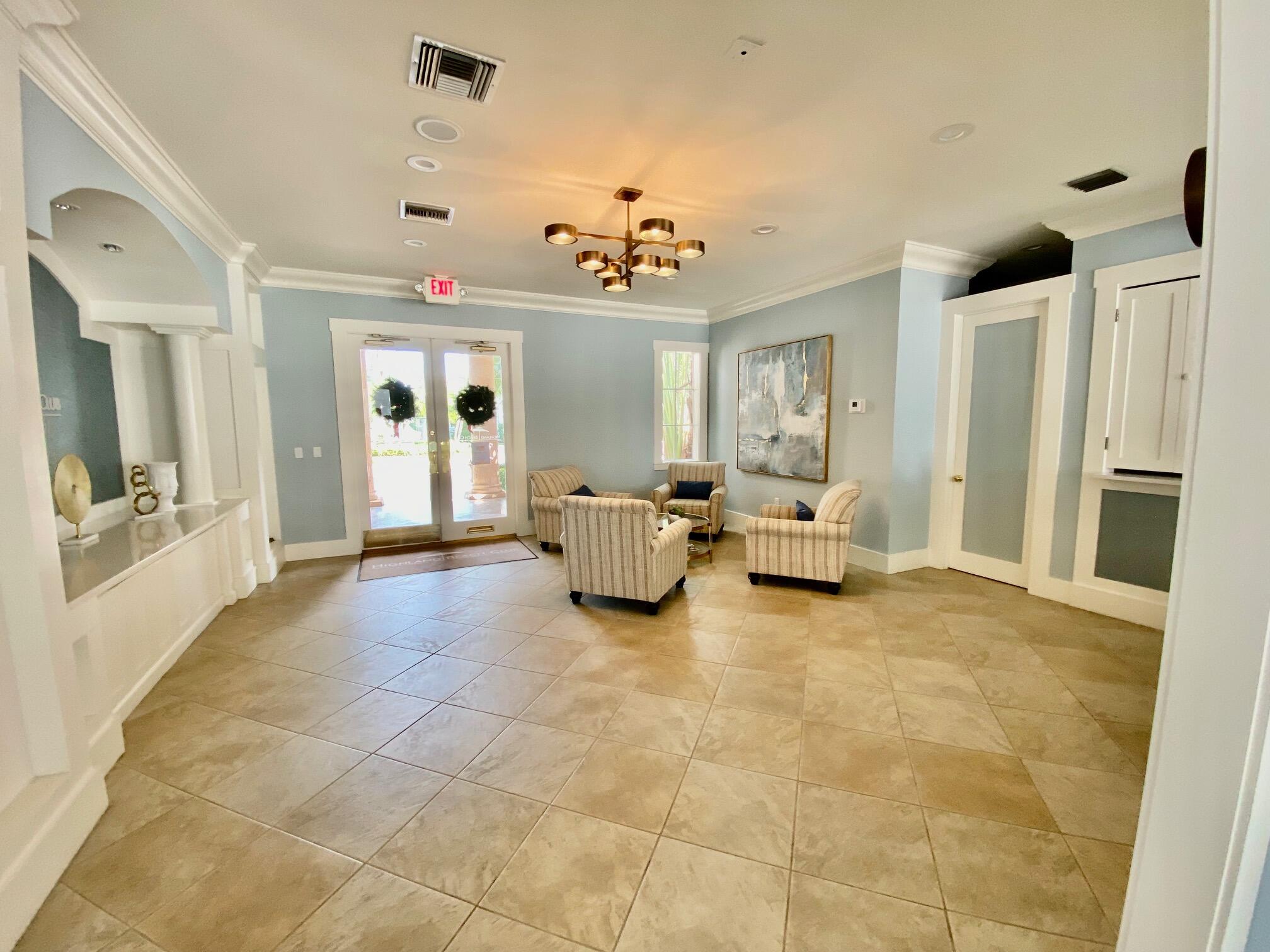 3594 South Ocean Boulevard, Unit 207 Highland Beach, FL 33487 - Photo 50 of 56 a living room with furniture and a chandelier