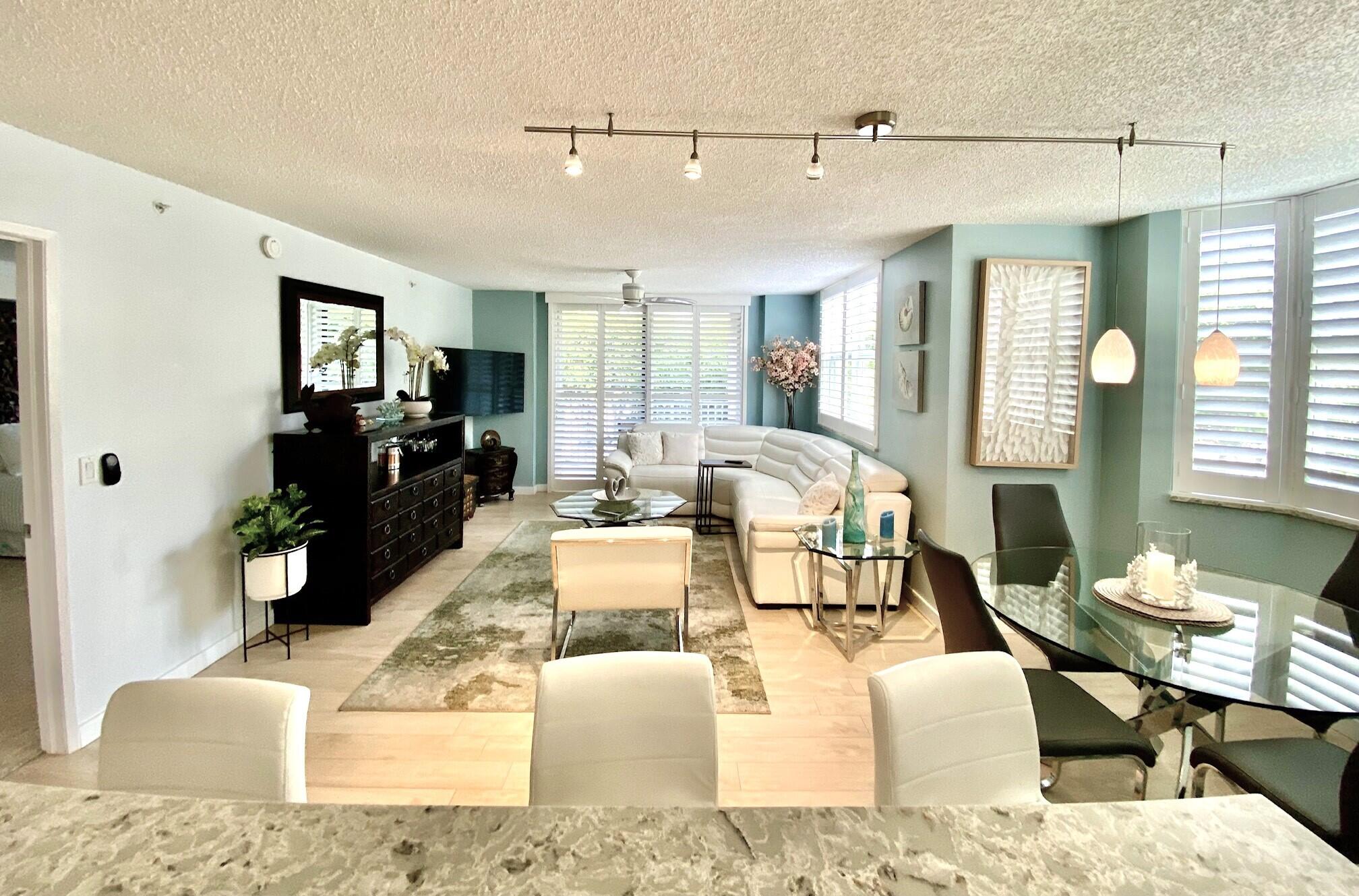 3594 South Ocean Boulevard, Unit 207 Highland Beach, FL 33487 - Photo 8 of 56 a living room with furniture window and wooden floor