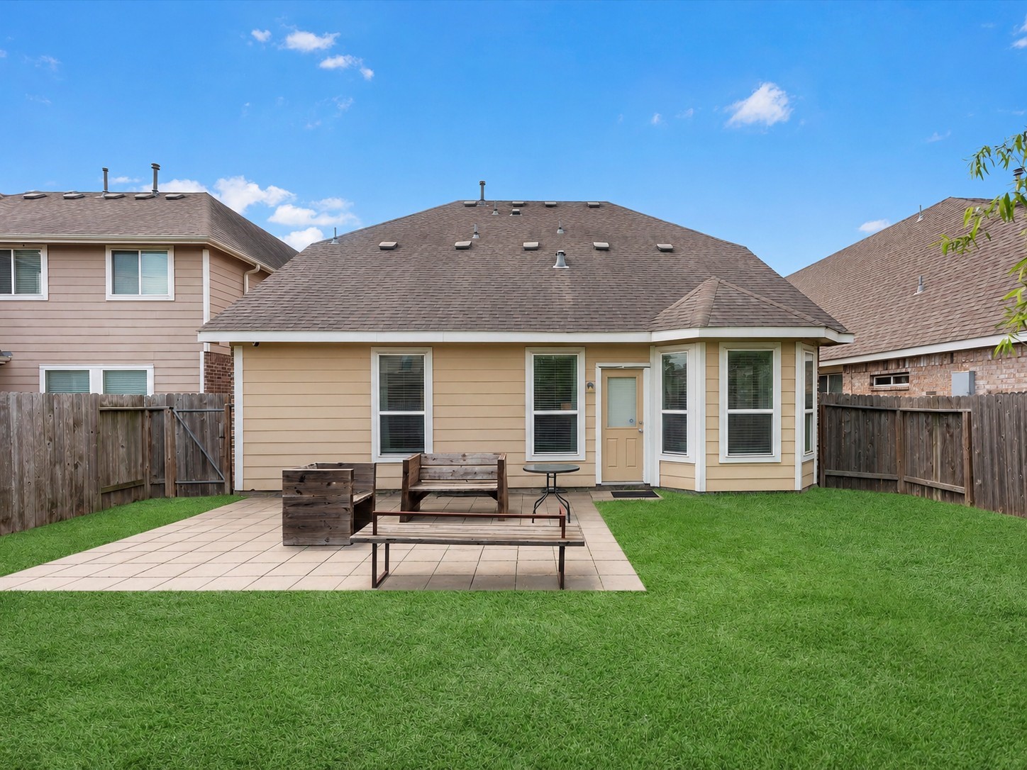 21554 Rainfall Park Drive Spring, TX 77388 - Photo 28 of 33 Backyard with a fenced yard and patio area offering a cozy outdoor space for relaxation or entertaining.