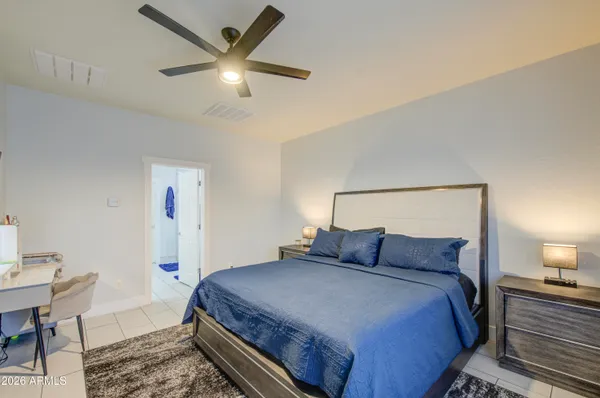 a bedroom with a bed and cabinets