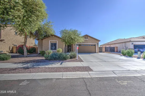 a front view of a house with yard