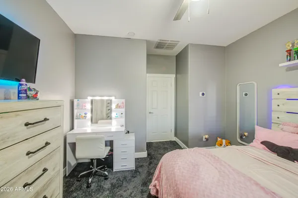 a bathroom with double sink and a mirror