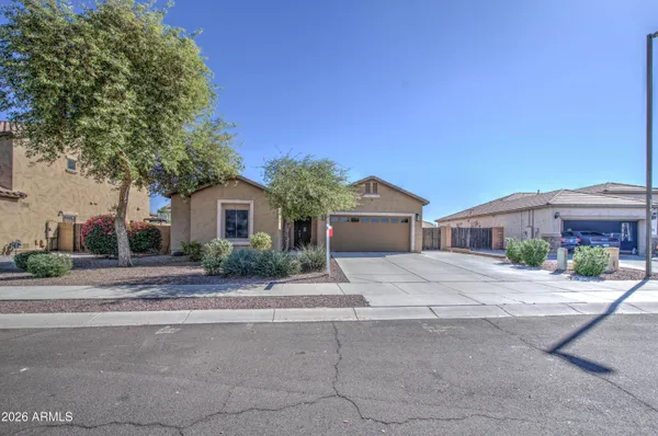 a front view of house with yard and car parked