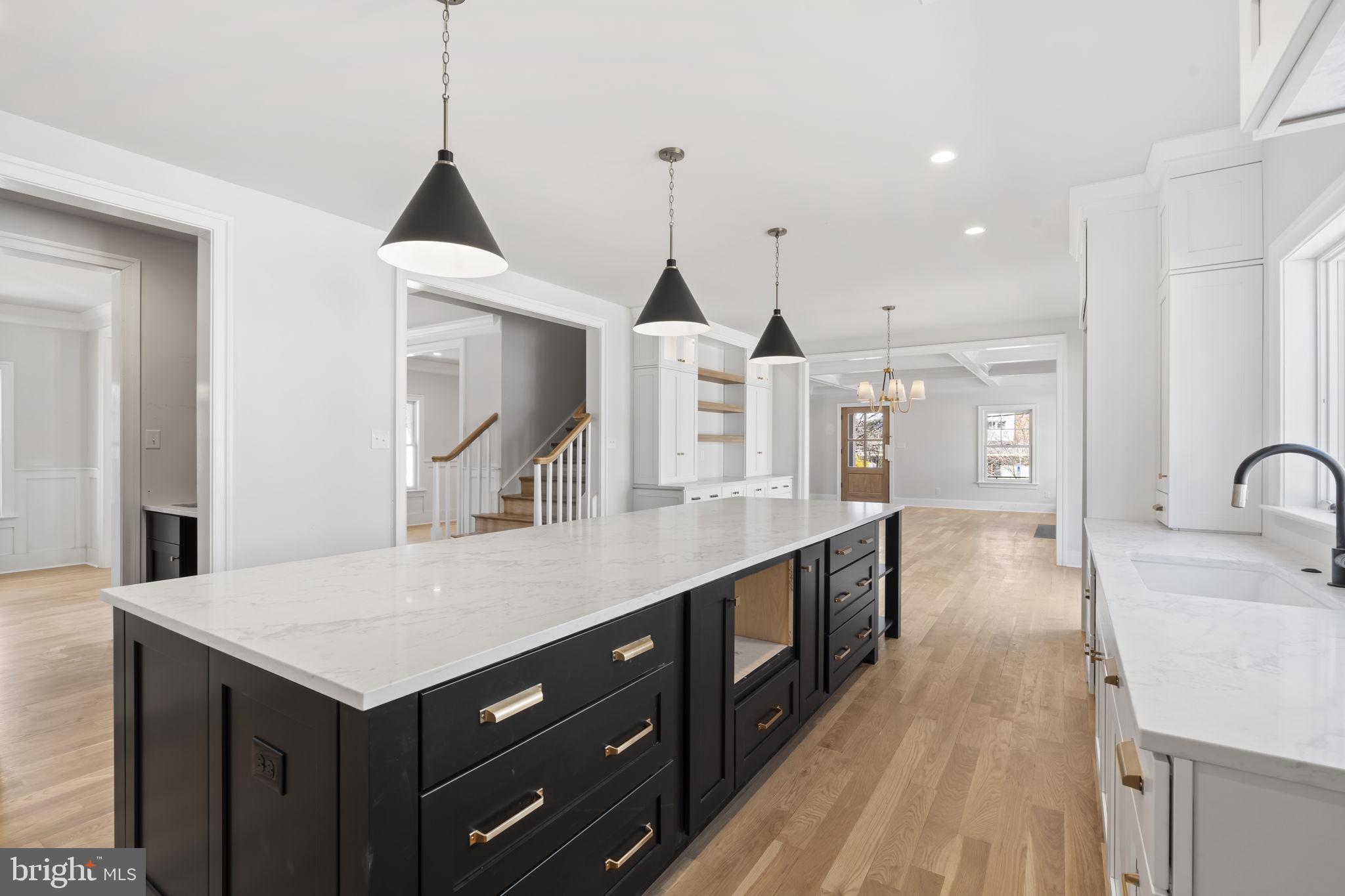 39 Simpson Road Ardmore, PA 19003 - Photo 12 of 49 a kitchen with a stove a sink and a wooden floors