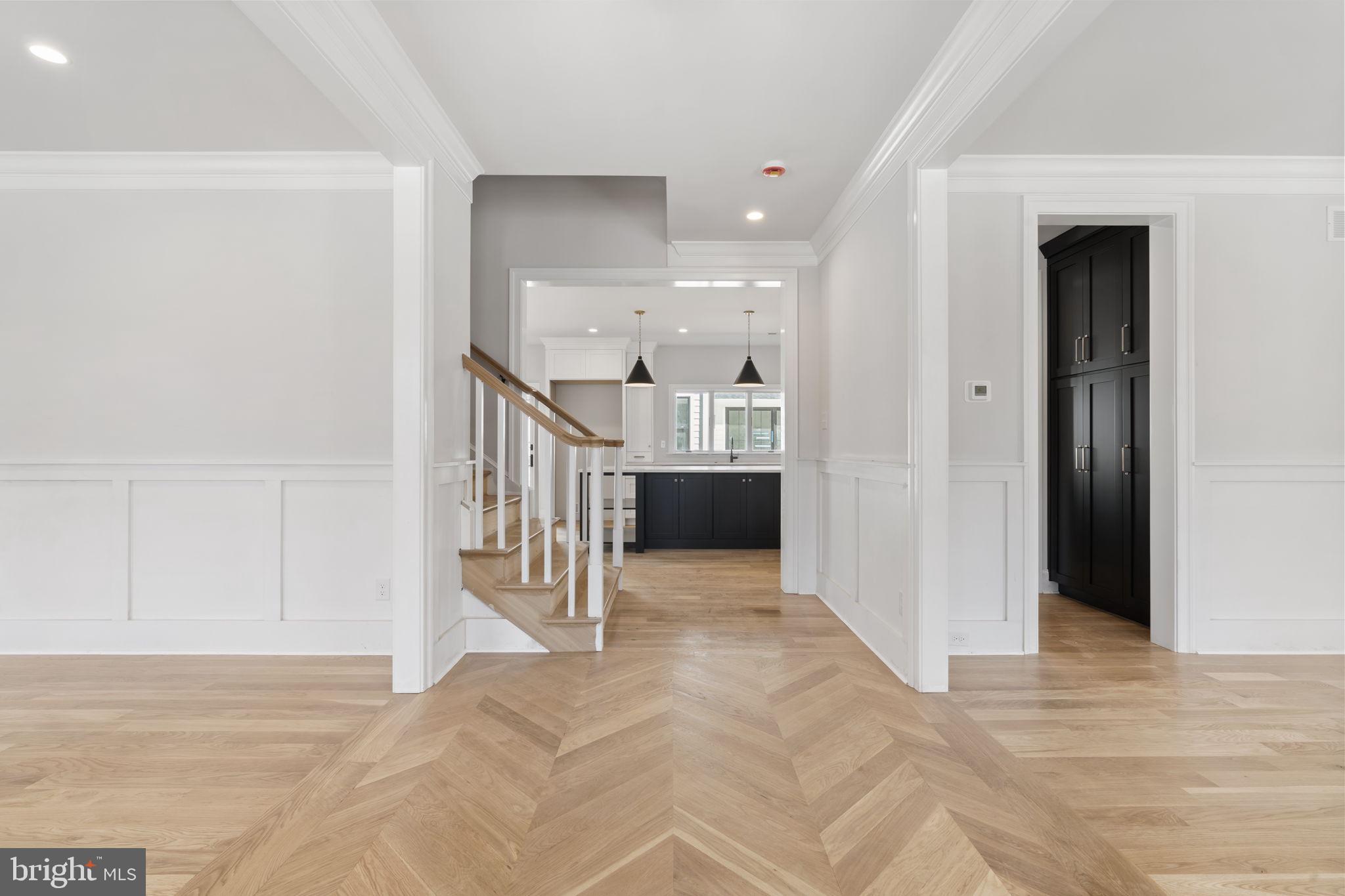 39 Simpson Road Ardmore, PA 19003 - Photo 17 of 49 a view of a hallway with wooden floor and staircase