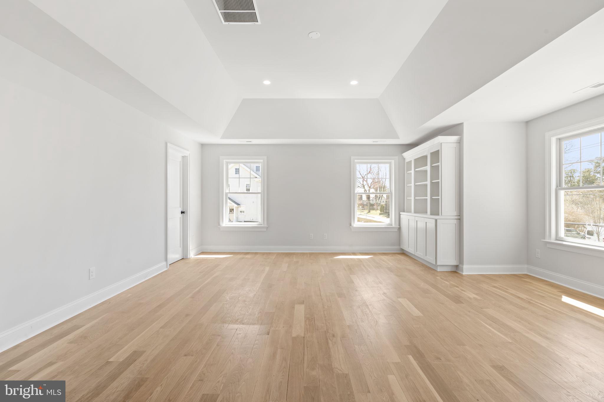 39 Simpson Road Ardmore, PA 19003 - Photo 25 of 49 an empty room with wooden floor and windows