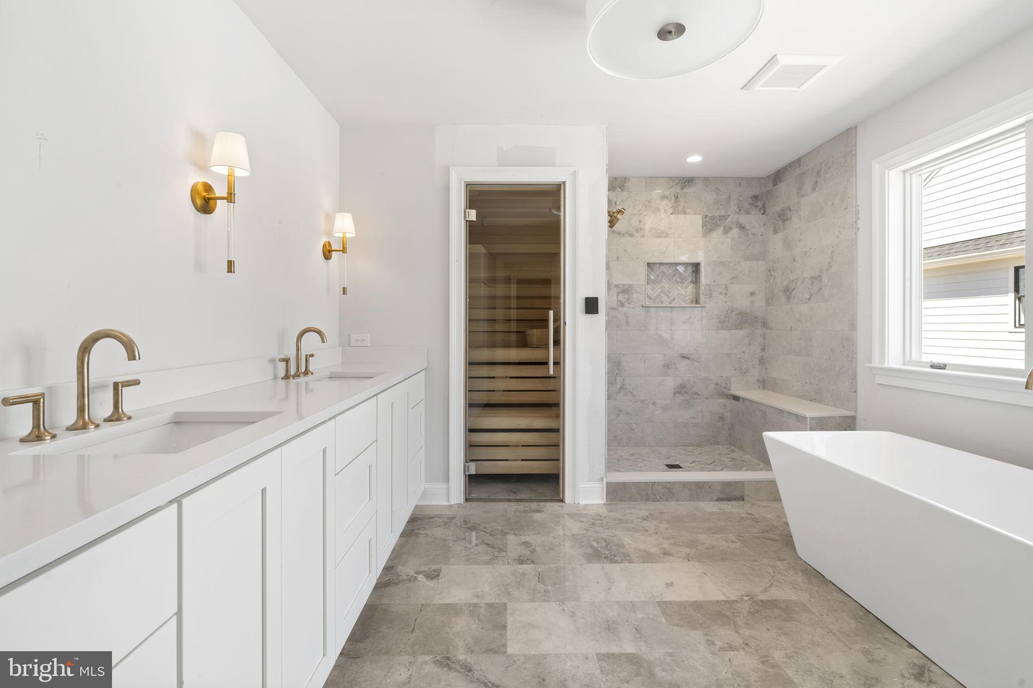 39 Simpson Road Ardmore, PA 19003 - Photo 27 of 49 a bathroom with a tub a sink and a shower