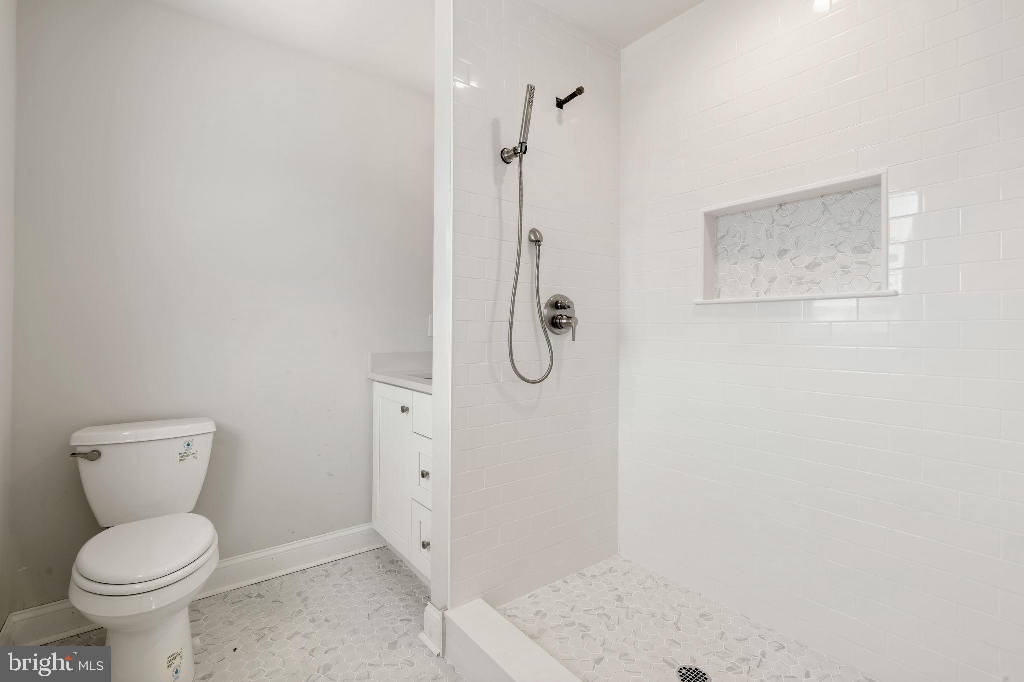 39 Simpson Road Ardmore, PA 19003 - Photo 34 of 49 a bathroom with a toilet and a shower