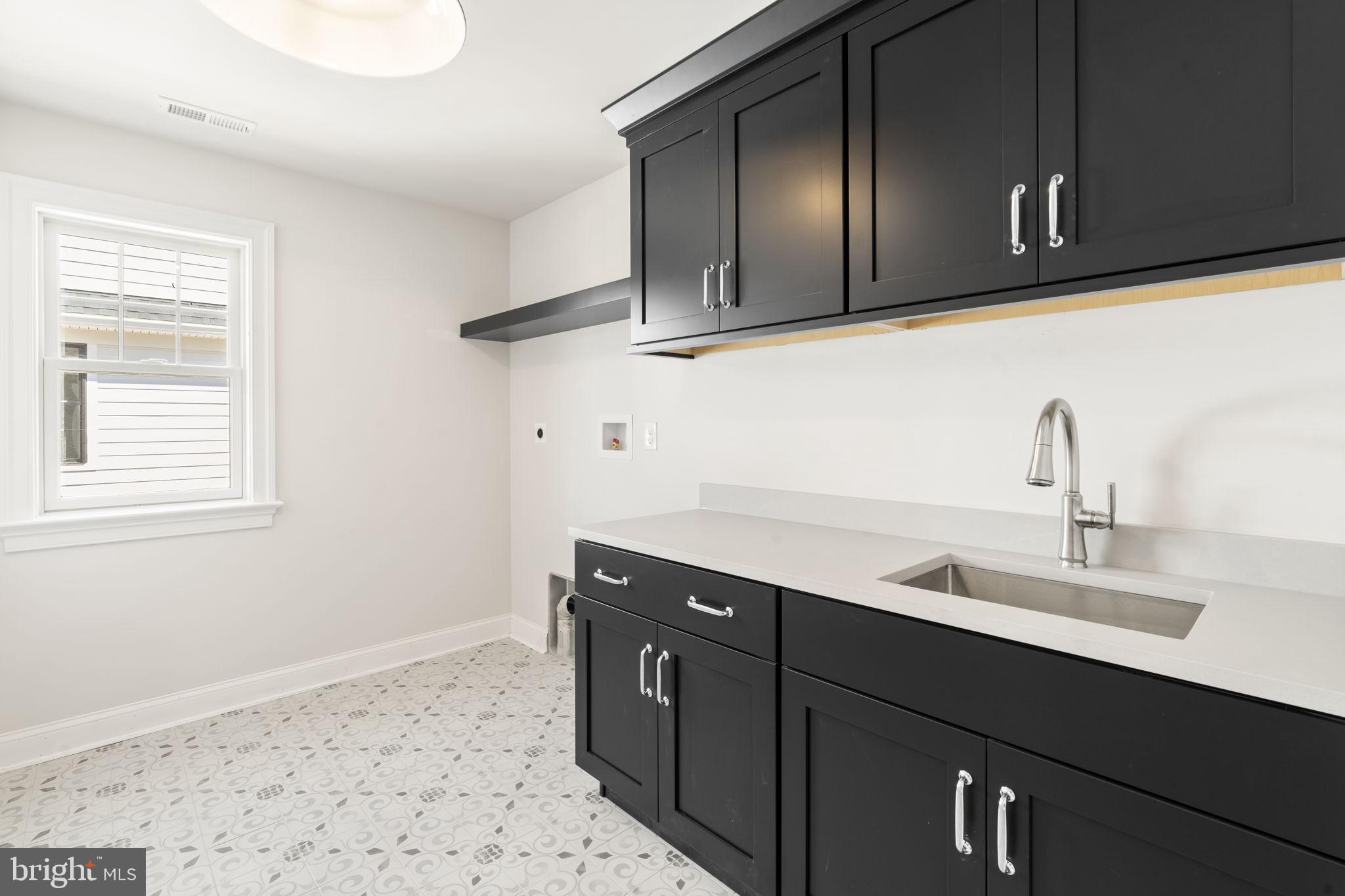 39 Simpson Road Ardmore, PA 19003 - Photo 35 of 49 a bathroom with a sink and a mirror
