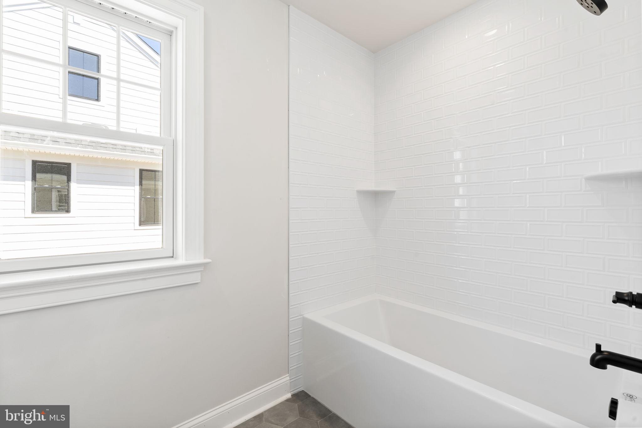 39 Simpson Road Ardmore, PA 19003 - Photo 37 of 49 a white bath tub sitting next to a window