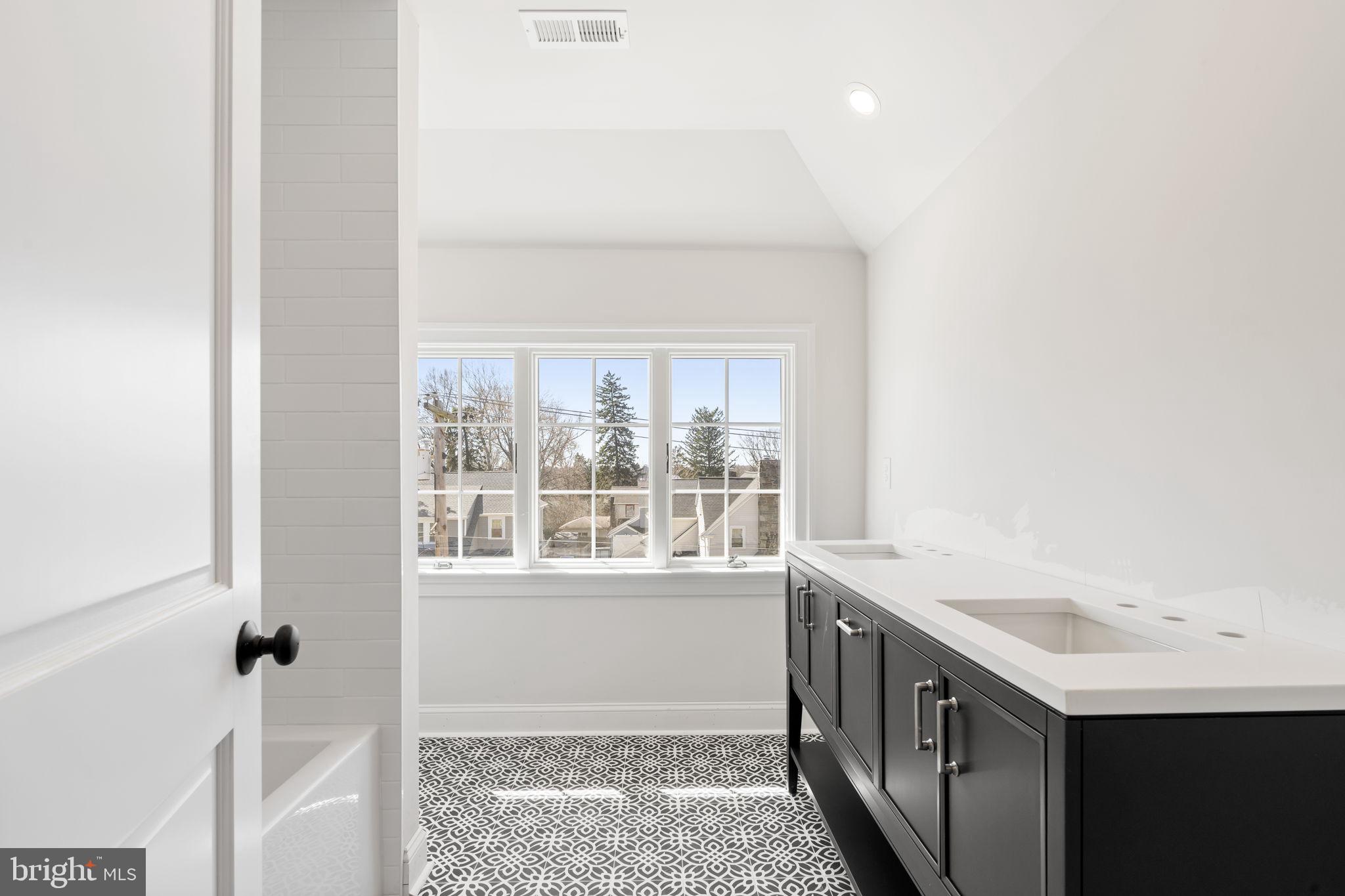 39 Simpson Road Ardmore, PA 19003 - Photo 42 of 49 a utility room with a sink a washer and dryer