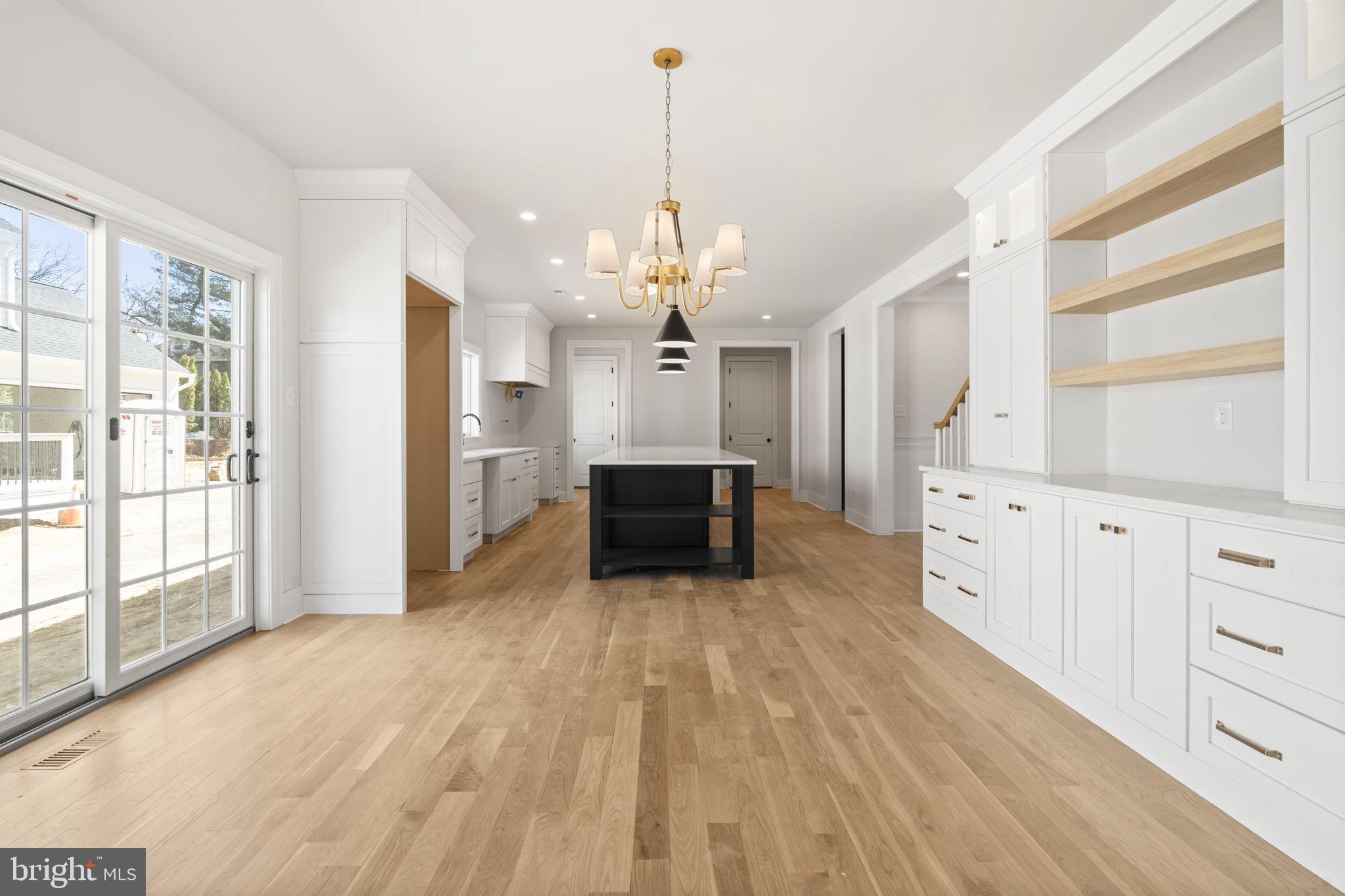 39 Simpson Road Ardmore, PA 19003 - Photo 7 of 49 a spacious bathroom with a granite countertop sink a mirror and a shower