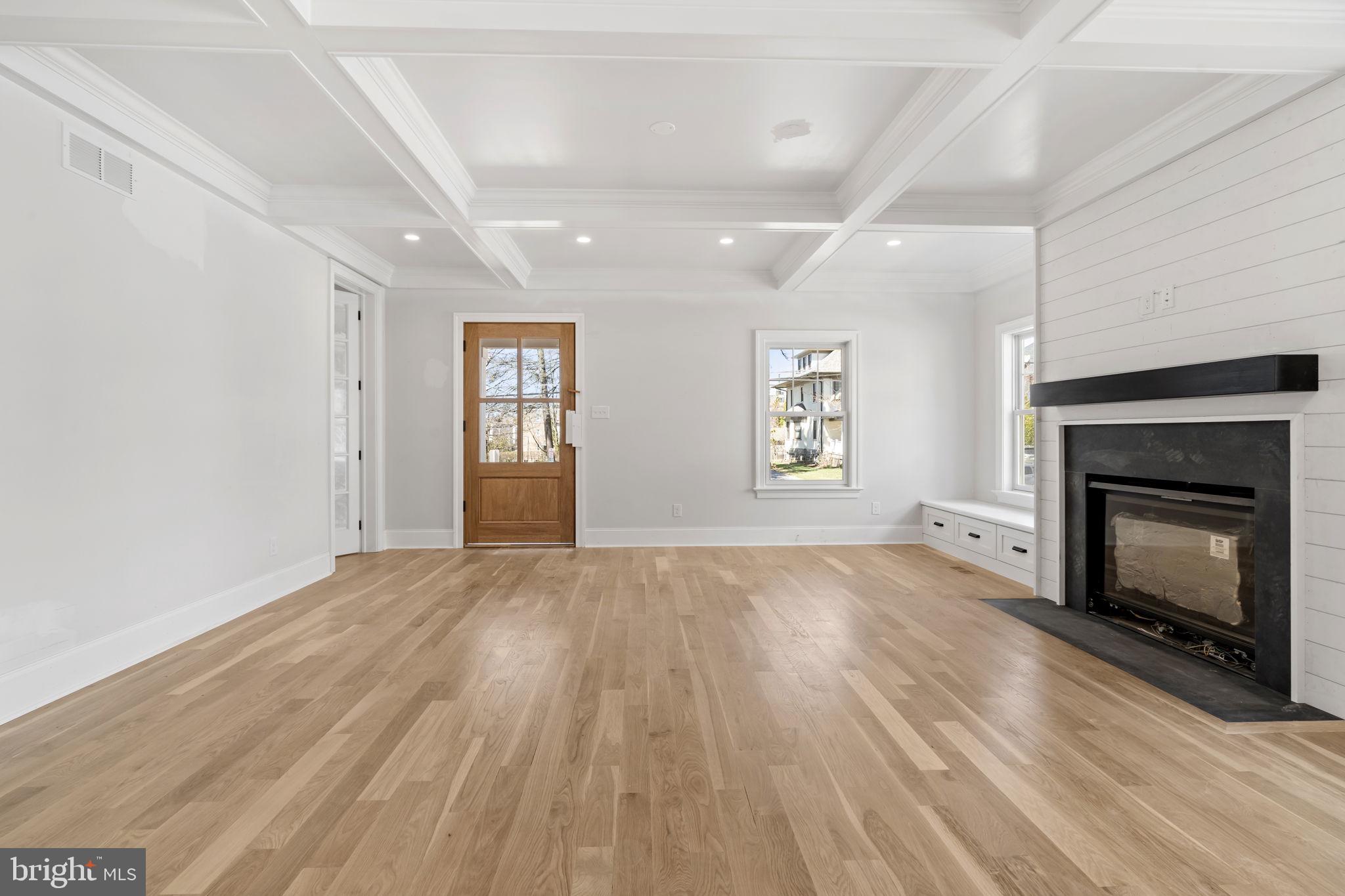 39 Simpson Road Ardmore, PA 19003 - Photo 8 of 49 an empty room with windows and fireplace