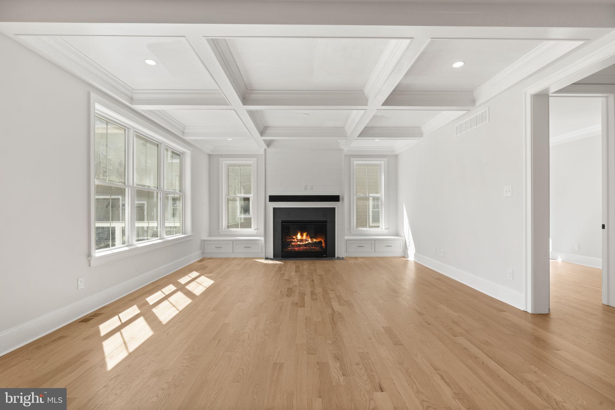 39 Simpson Road Ardmore, PA 19003 - Photo 9 of 49 a view of an empty room with wooden floor fireplace and a window