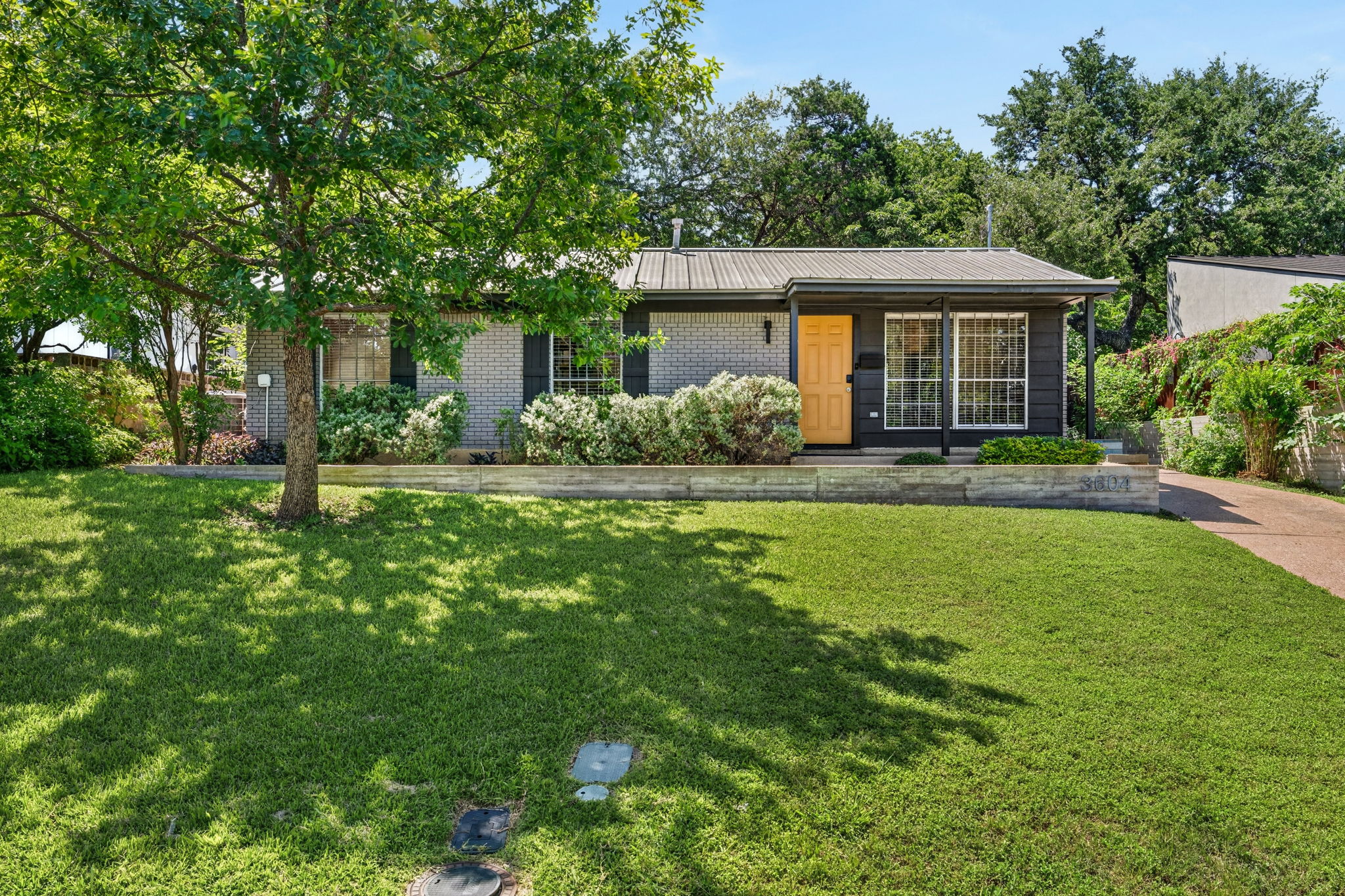 3604 Wilson Street Austin, TX 78704 - Photo 1 of 25 a front view of a house with a yard