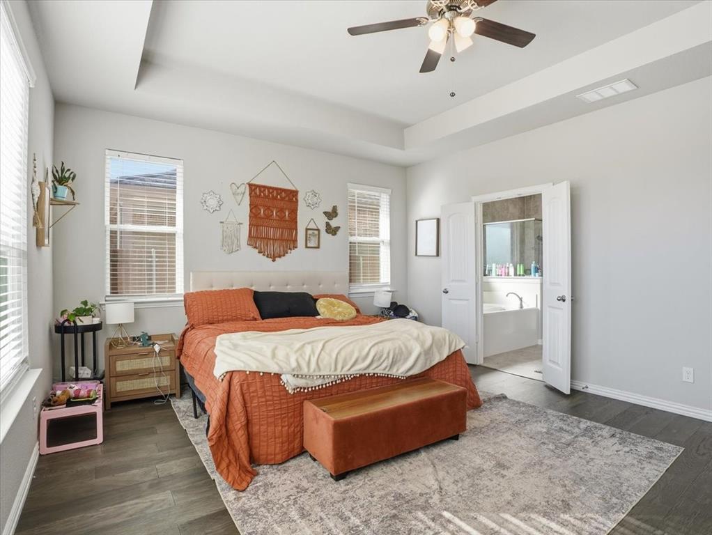 312 Welch Folly Lane Aledo, TX 76008 - Photo 15 of 33 a bedroom with bed and wooden floor
