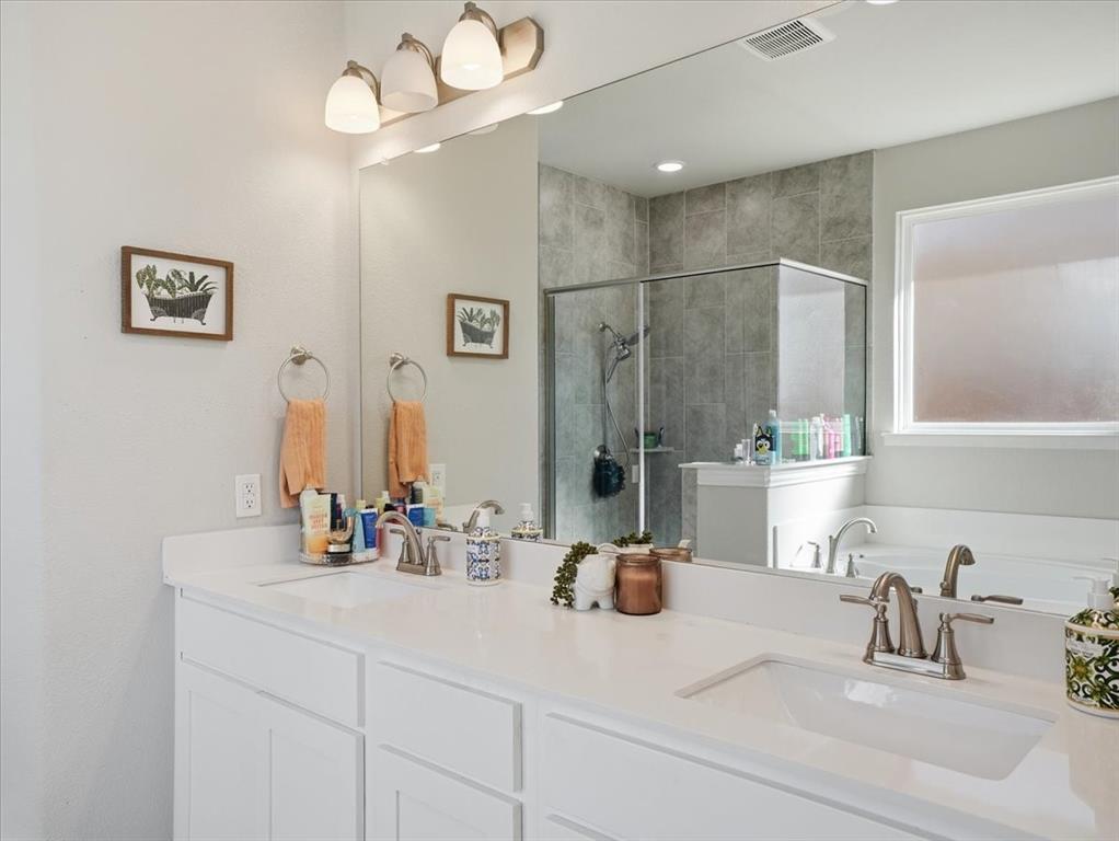 312 Welch Folly Lane Aledo, TX 76008 - Photo 16 of 33 a bathroom with a sink and a mirror