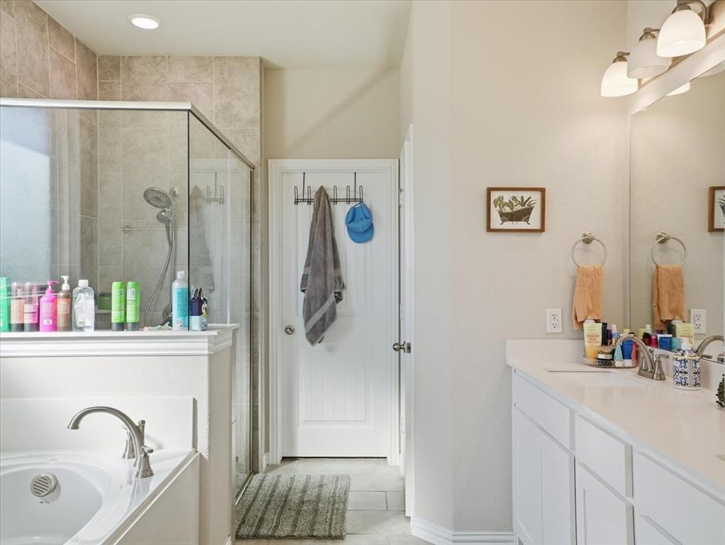 312 Welch Folly Lane Aledo, TX 76008 - Photo 17 of 33 a bathroom with a sink and a mirror