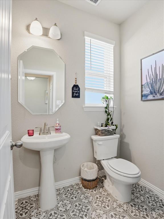312 Welch Folly Lane Aledo, TX 76008 - Photo 20 of 33 a bathroom with a toilet sink and mirror