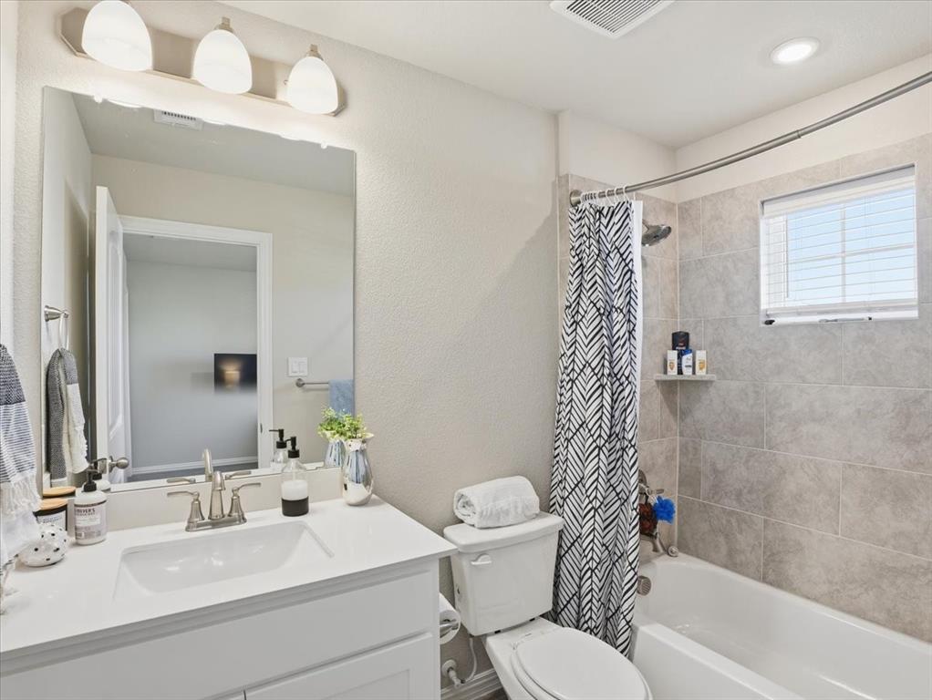 312 Welch Folly Lane Aledo, TX 76008 - Photo 28 of 33 a bathroom with a sink a toilet and shower