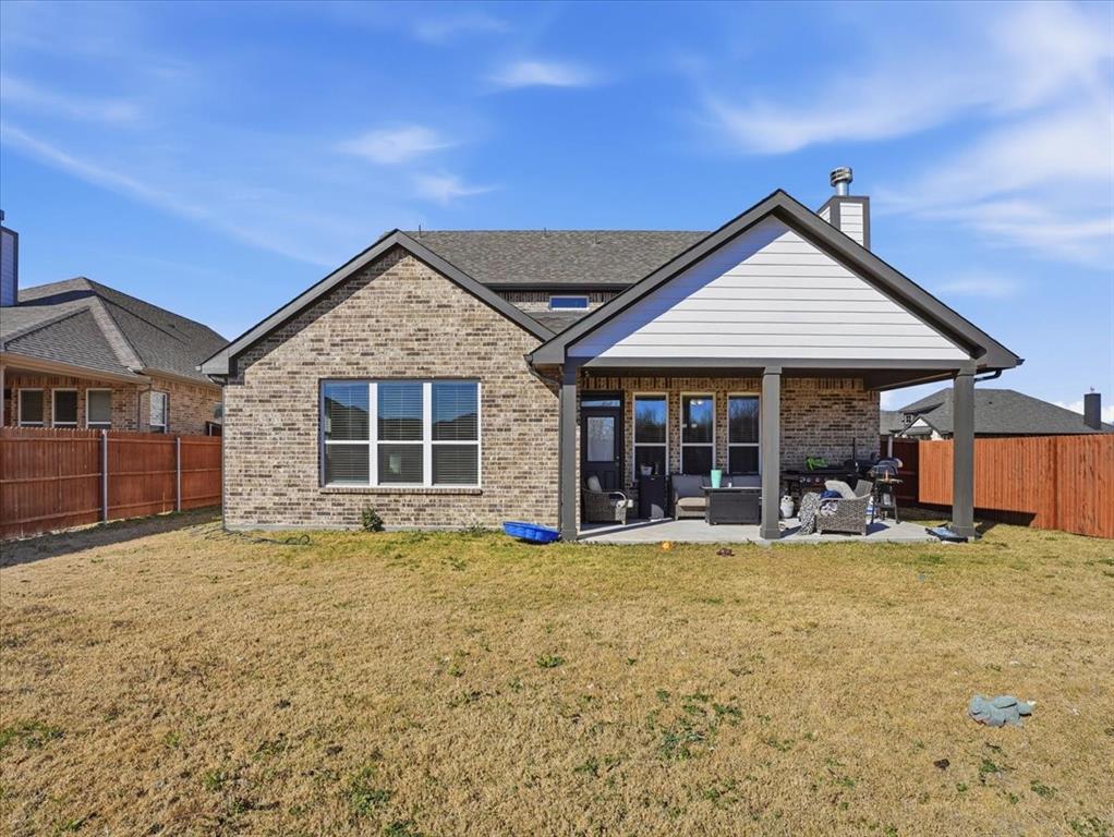 312 Welch Folly Lane Aledo, TX 76008 - Photo 32 of 33 a view of a house with a yard and sitting area