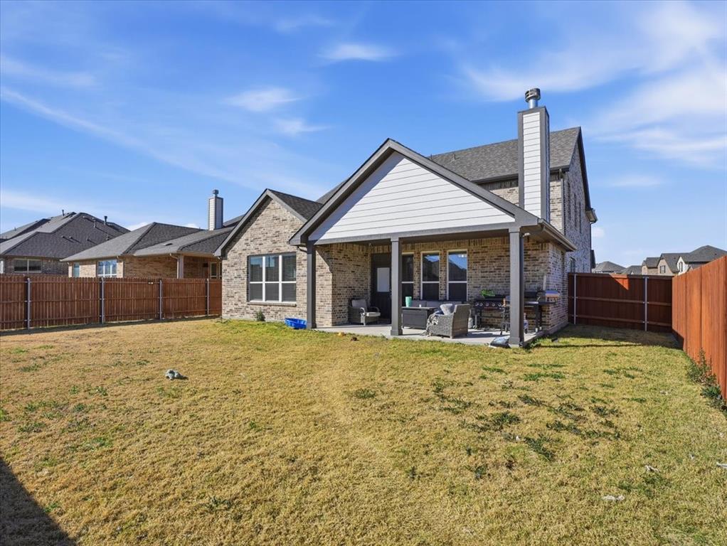 312 Welch Folly Lane Aledo, TX 76008 - Photo 33 of 33 a view of a house with a yard and sitting area
