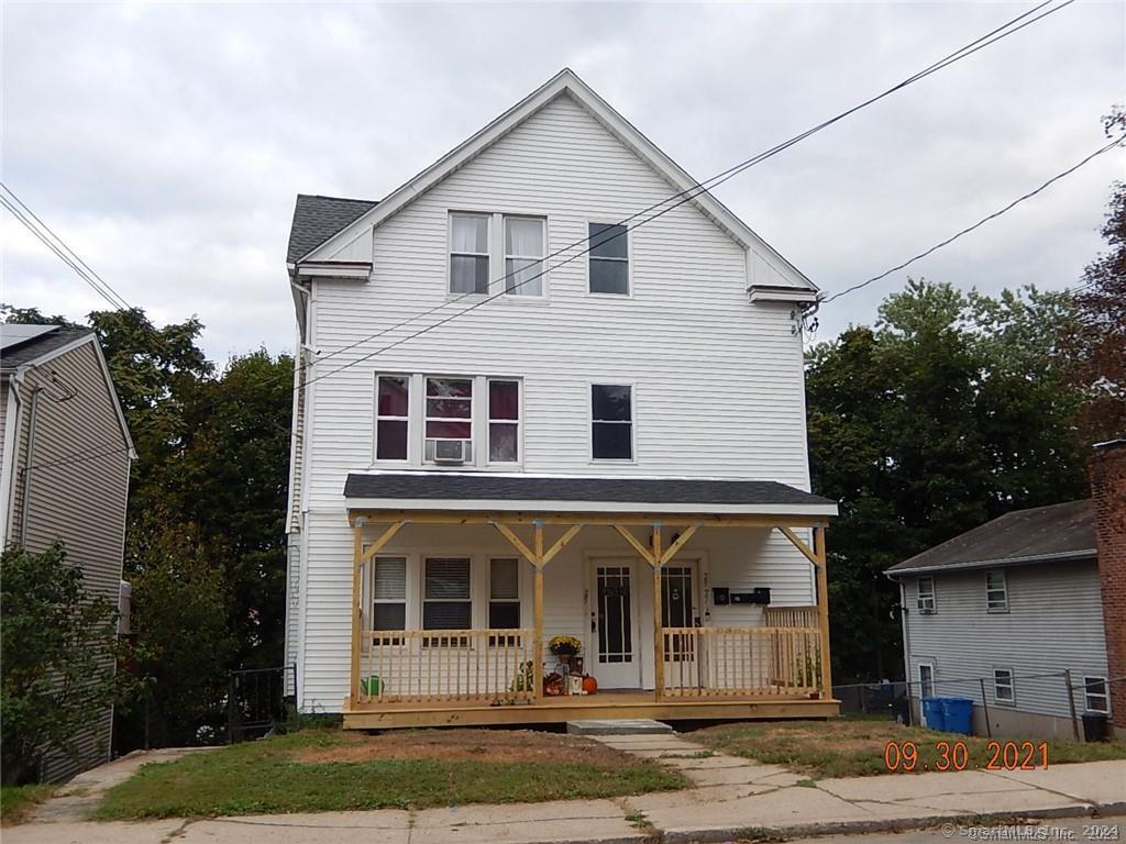 a front view of a house with a porch