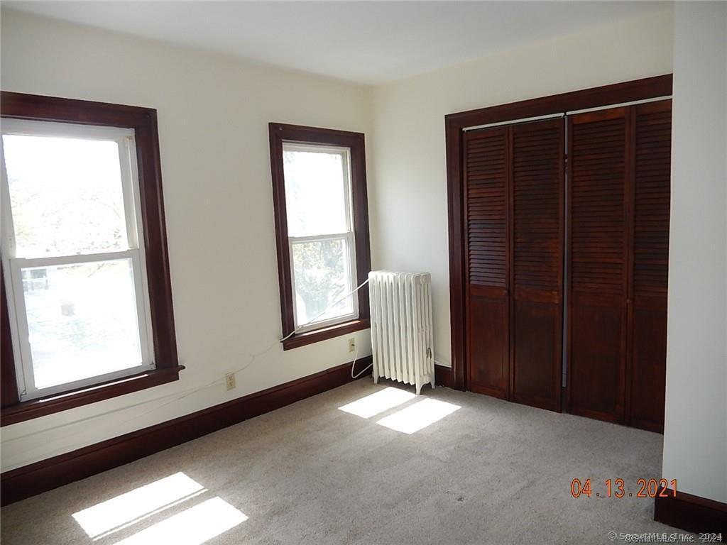25 Pratt Street, Unit 3 Bristol, CT 06010 - Photo 3 of 10 a view of empty room with windows