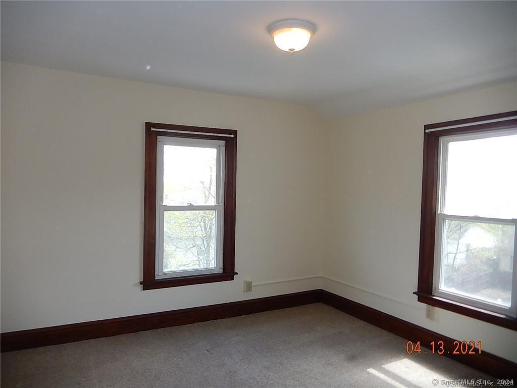 25 Pratt Street, Unit 3 Bristol, CT 06010 - Photo 4 of 10 an empty room with a window