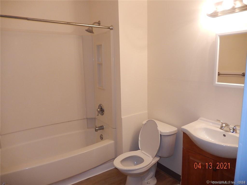 25 Pratt Street, Unit 3 Bristol, CT 06010 - Photo 7 of 10 a bathroom with a toilet a sink and bathtub