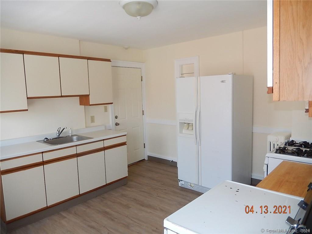 25 Pratt Street, Unit 3 Bristol, CT 06010 - Photo 8 of 10 a kitchen with a sink and cabinets