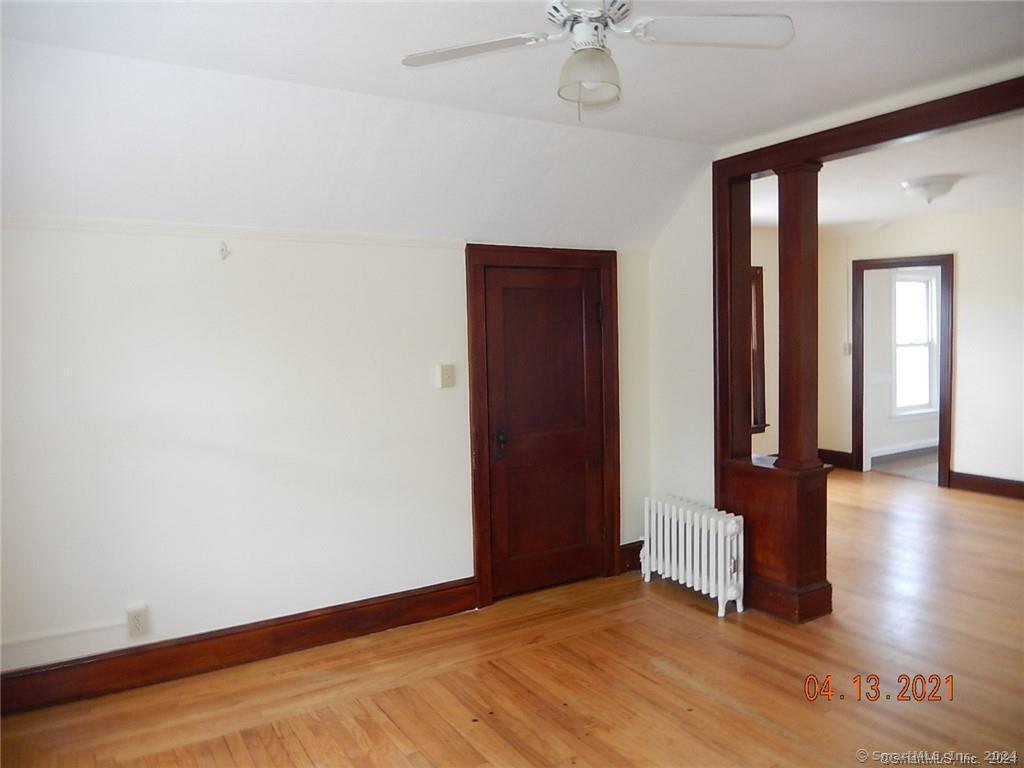 25 Pratt Street, Unit 3 Bristol, CT 06010 - Photo 9 of 10 an empty room with wooden floor and closet