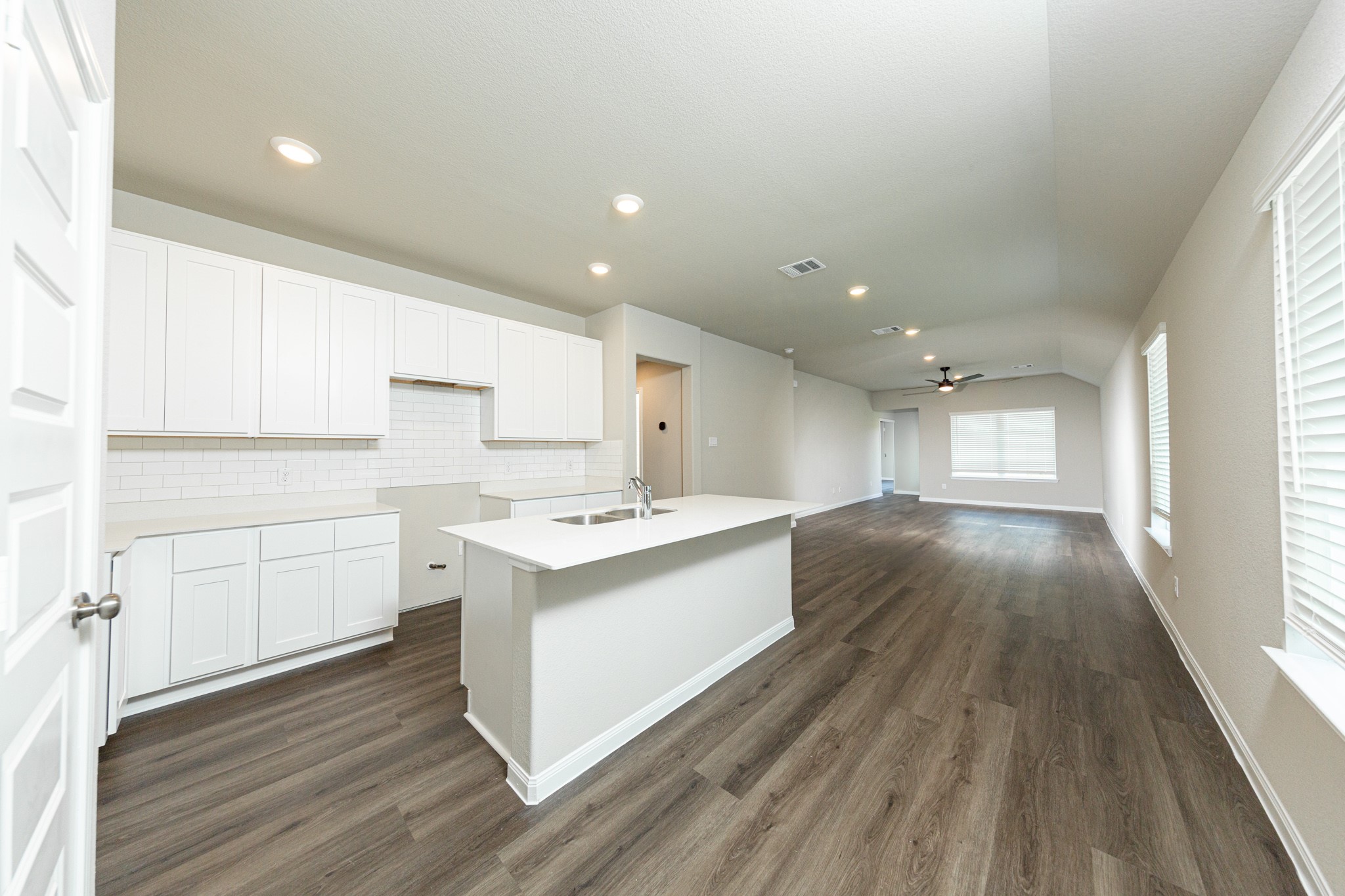13654 Kit Run Splendora, TX 77372 - Photo 3 of 24 a view of a kitchen with wooden floor and electronic appliances