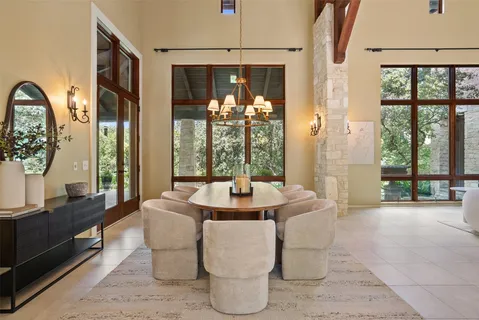 a dining room with furniture and window