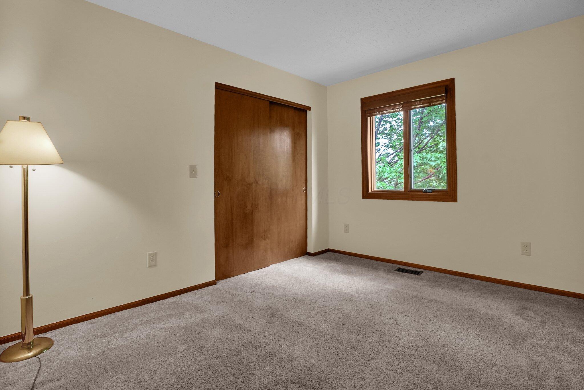 623 Rockbridge Road Westerville, OH 43081 - Photo 32 of 63 Bedroom #2: Located next to the shared hall bathroom, overlooking the backyard, this room has neutral carpets, walls, and ample closet space!