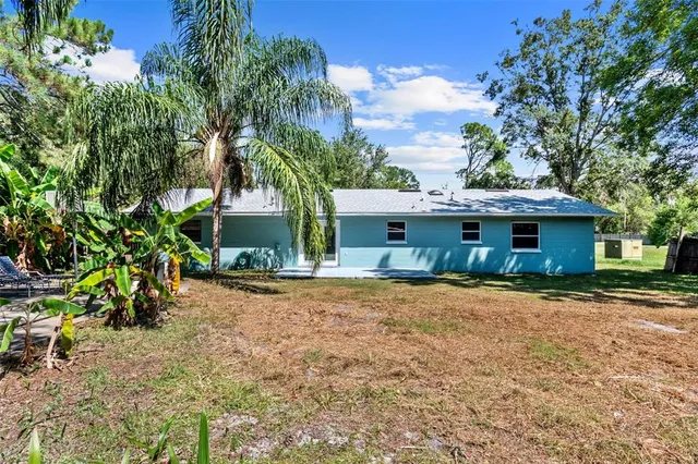 a front view of a house with a yard and a garage