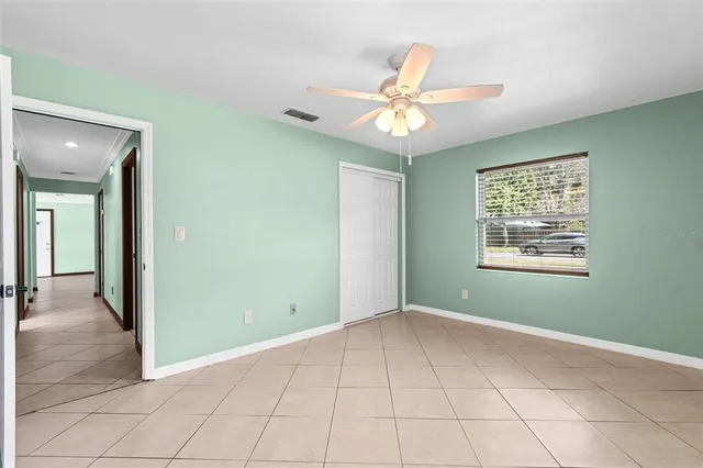 a view of an empty room with a window