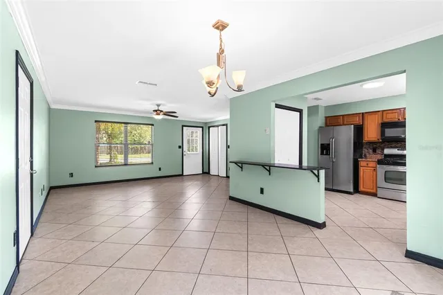 a view of a livingroom with furniture and window