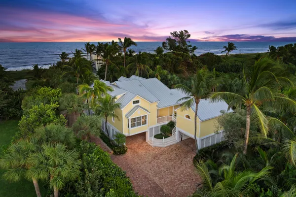 a aerial view of a house with a yard