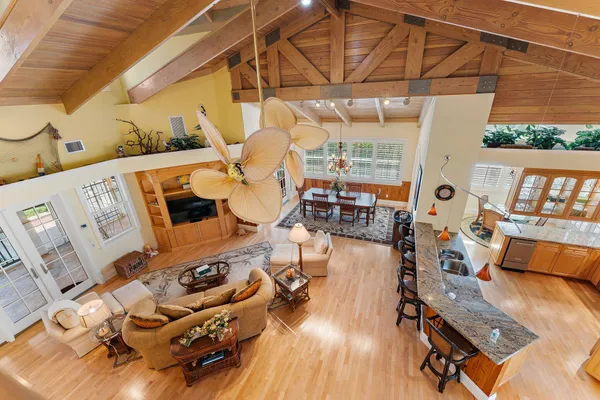 a view of living room with furniture and wooden floor