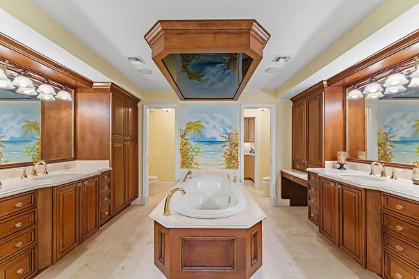 a bathroom with a sink a vanity and a mirror