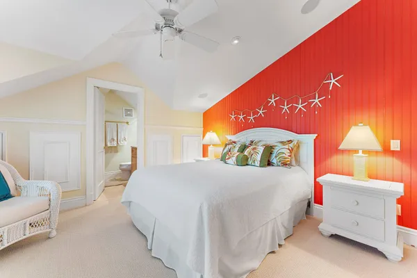 a bedroom with a bed and a couch
