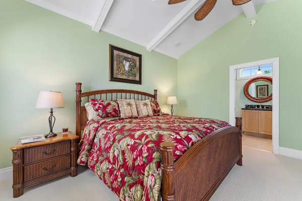 a bedroom with a bed and a lamp