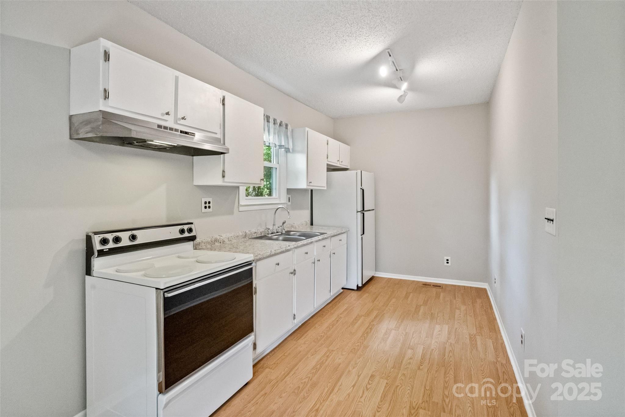 29 7th Street York, SC 29745 - Photo 16 of 22 a kitchen with stainless steel appliances granite countertop a stove and a sink