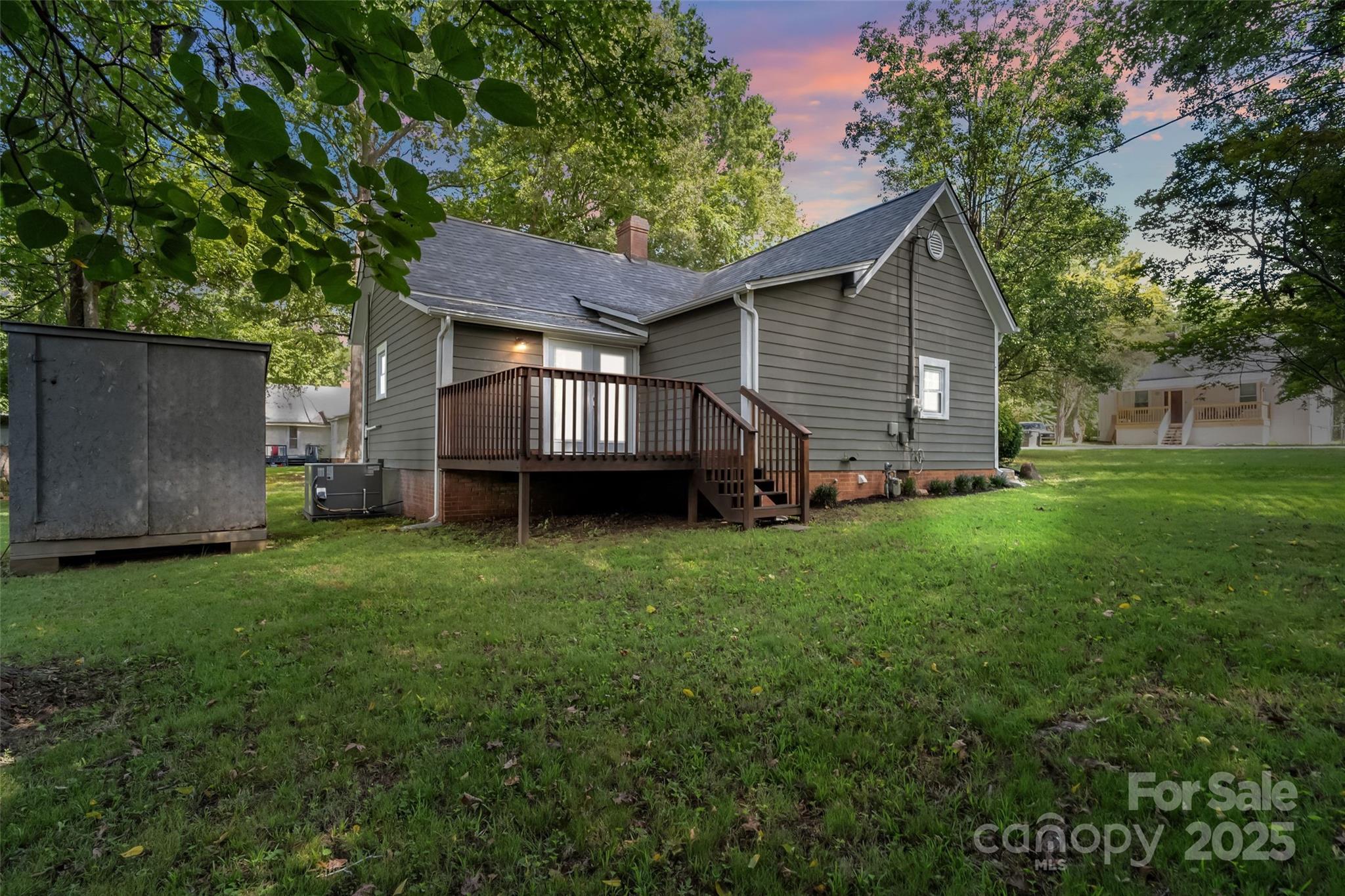 29 7th Street York, SC 29745 - Photo 20 of 22 a backyard of a house with wooden deck and barbeque oven