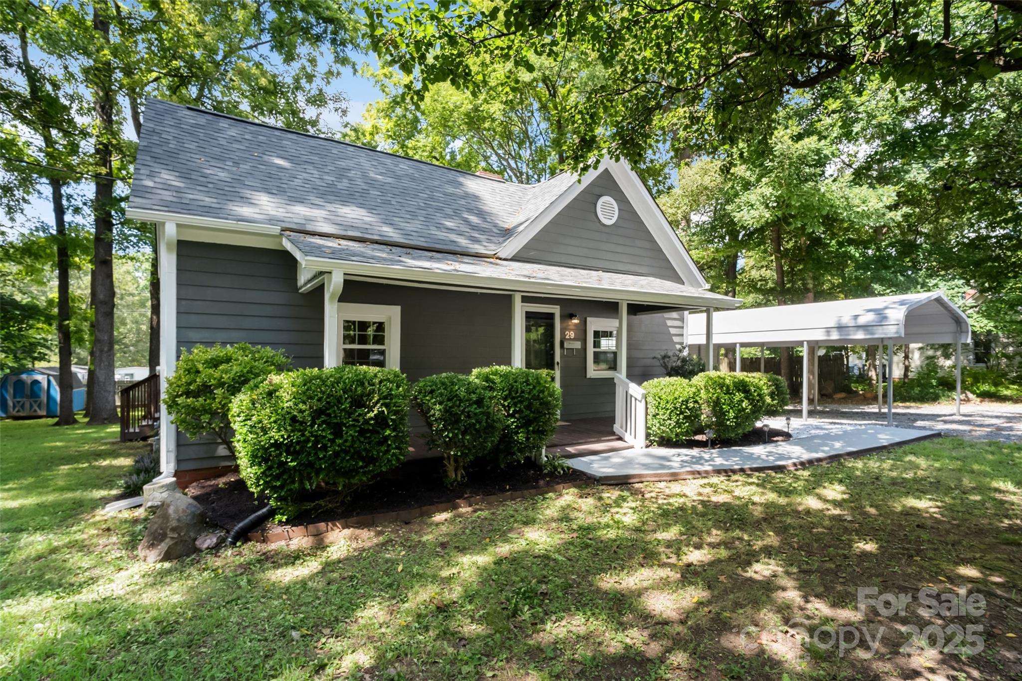 29 7th Street York, SC 29745 - Photo 3 of 22 a front view of a house with garden