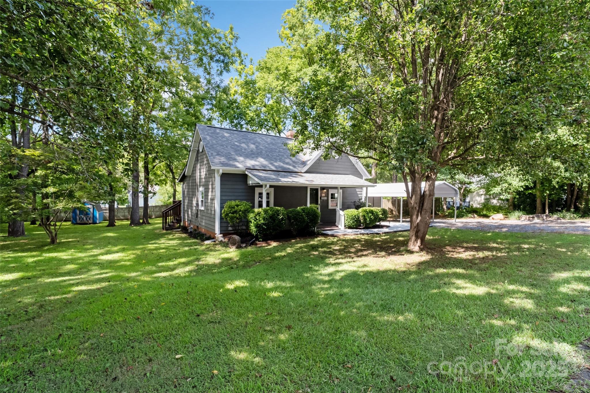 29 7th Street York, SC 29745 - Photo 4 of 22 a front view of a house with a garden