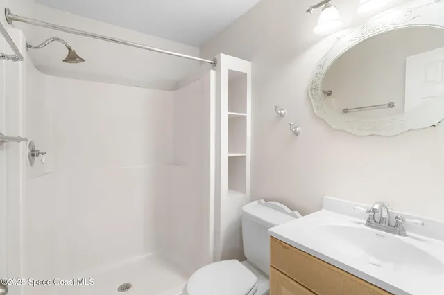 a view of room with window and ceiling fan